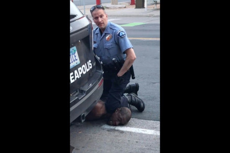 A Minneapolis police officer holds his knee to the neck of George Floyd, who died in police custody.