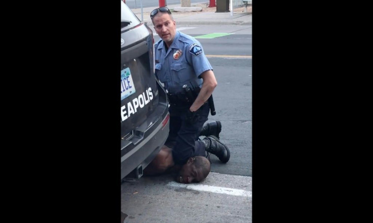 A Minneapolis police officer holds his knee to the neck of George Floyd, who died in police custody.