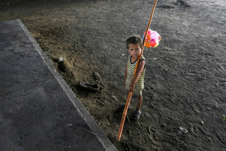 A child is seen in Karachi, Pakistan -- the majority of children at risk of poverty live in South Asia and sub-Saharan Africa, but the coronavirus pandemic will see a surge in Europe and Central Asia, a study shows