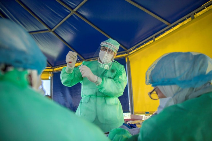 A medical worker packages a sample from a taxi driver while testing for COVID-19 in Morocco's capital Rabat