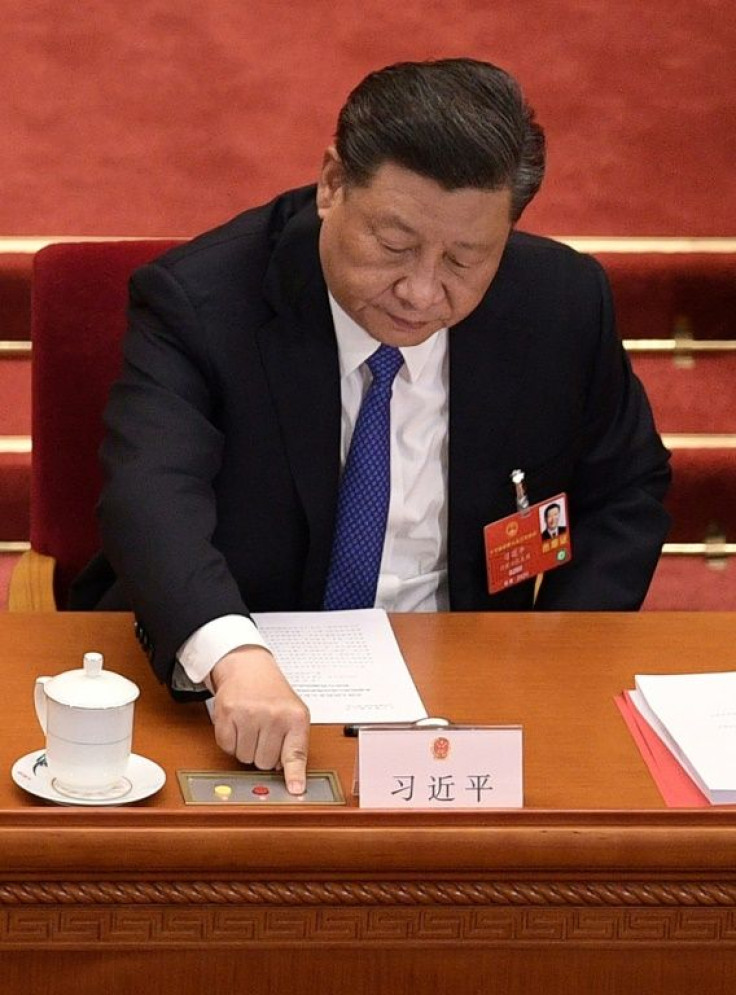Chinese President Xi Jinping votes on the plan to produce a law banning secession in Hong Kong