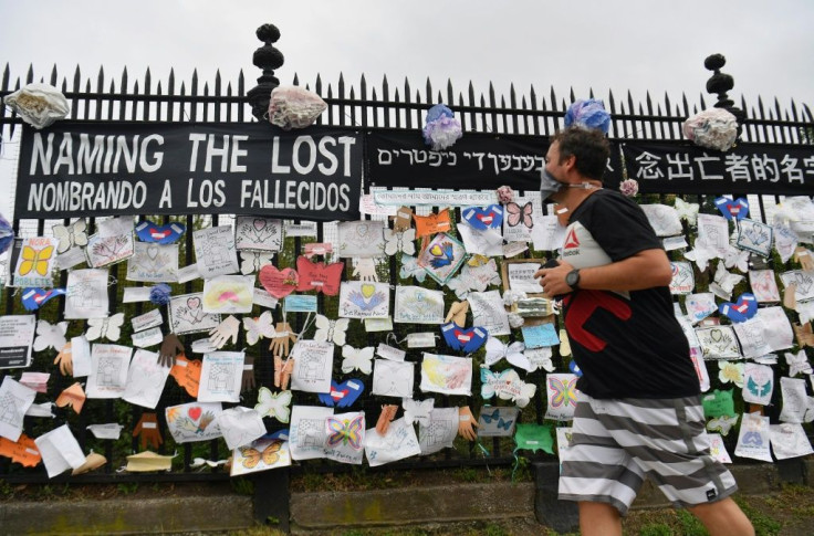 A man walks past a memorial dedicated to those who lost their lives to COVID-19 at Greenwood Cemetery in New York City -- one of the areas in the US hardest hit by the epidemic