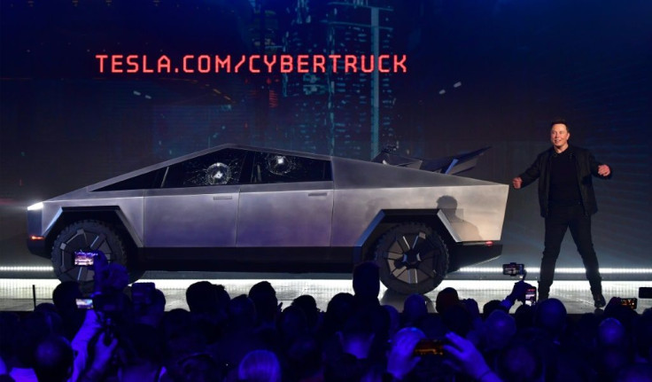 Tesla co-founder and CEO Elon Musk on stage with  the newly unveiled all-electric battery-powered Tesla Cybertruck with broken glass on windows following a demonstation that did not quite go as planned on November 21, 2019 in California