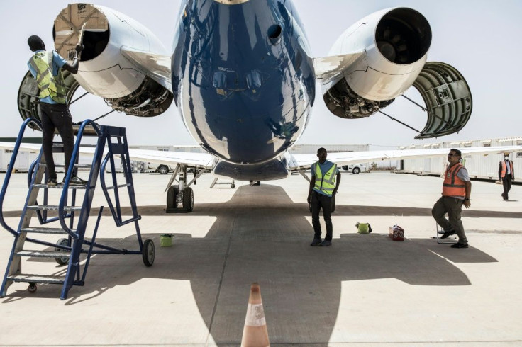 Transair's ground crew prepare a twin-jet Embraer for a one-hour technical flight, one of the few exceptions allowed under Senegal's anti-coronavirus restrictions