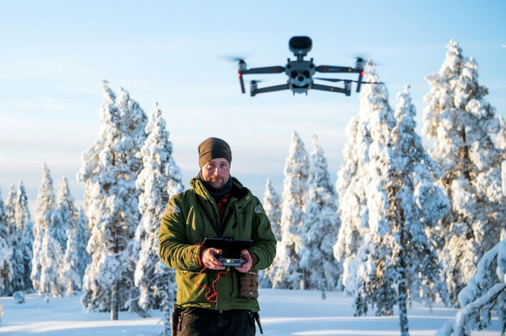 When snow is scarce, Daniel Viklund uses a drone to help herd the reindeer, as well as GPS collars