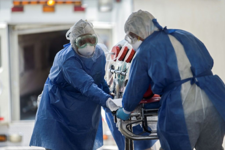 Mexican Red Cross' paramedics rush a patient suspected of being infected with the novel COVID-19 coronavirus into Venados General Hospital, in Mexico City