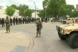 IMAGES National Guard soldiers are deployed in Minneapolis for peacekeeping after a third night of rioting over police brutality against African Americans left hundreds of shops damaged and a police station on fire.