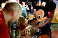 A visitor hugs Mickey Mouse at Disney World in Florida, which is set to reopen in July 2020 after a three-month closure due to the coronavirus pandemic