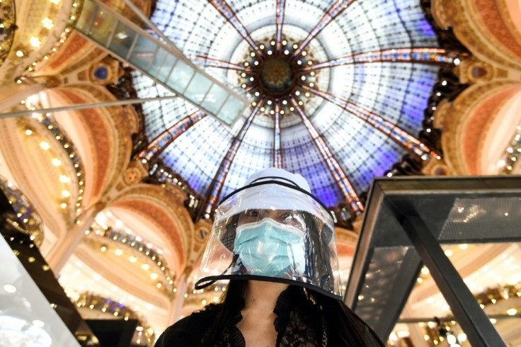 A shopper at Paris's famed Galeries Lafayette department, which reopened on Saturday