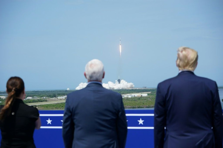 (L-R) Karen Pence, US Vice President Mike Pence and US President Donald Trump watch the SpaceX Falcon 9 rocket launch