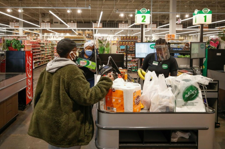 Service workers like cashiers are on the front lines of the pandemic and also on the low end of the US pay scale