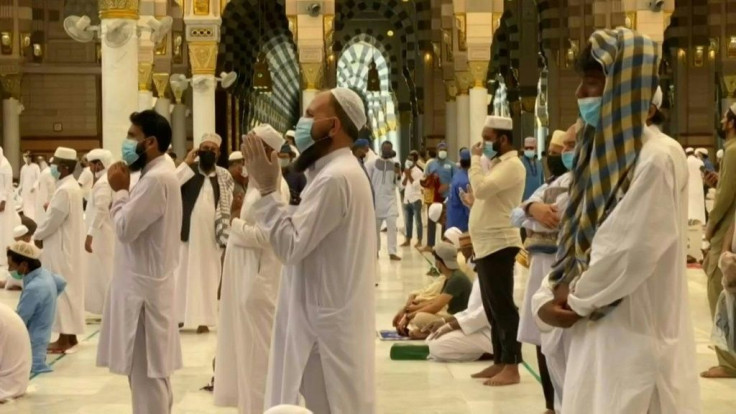 Worshippers pray at the Prophet's Mosque in the holy city of Medina after Saudi authorities allowed it to reopen at 40 percent capacity