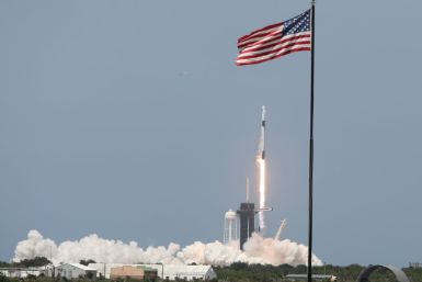 SpaceX's two-stage Falcon 9 rocket began its voyage Saturday, blasting off flawlessly in a cloud of bright orange flames and smoke from Florida's Kennedy Space Center