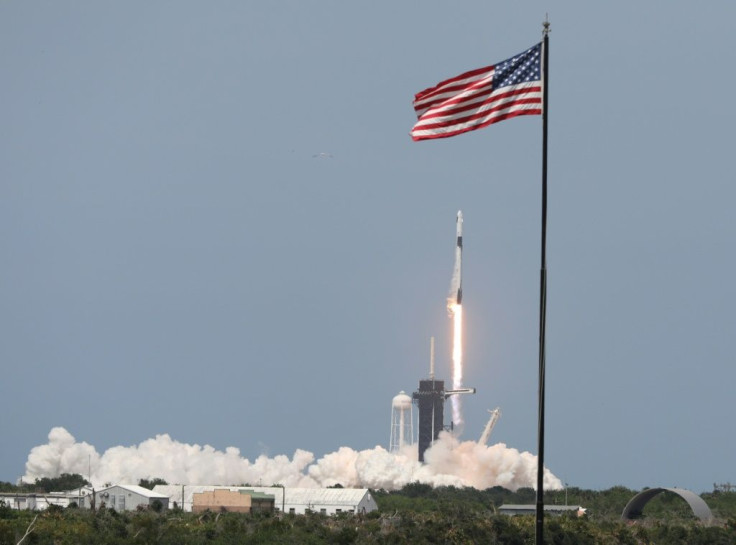 SpaceX's two-stage Falcon 9 rocket began its voyage Saturday, blasting off flawlessly in a cloud of bright orange flames and smoke from Florida's Kennedy Space Center