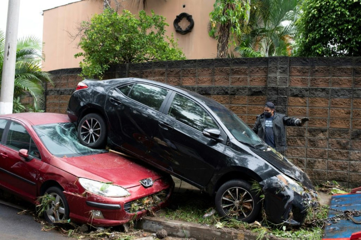 Flash-floods unleashed by Tropical Storm Amanda tossed cars around like toys in several San Salvador neighborhoods