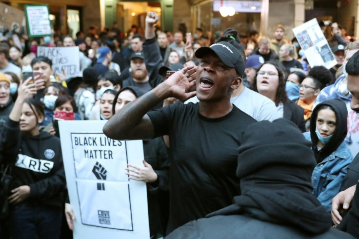 UFC figther Israel Adesanya was among thousands of New Zealanders who took to the streets