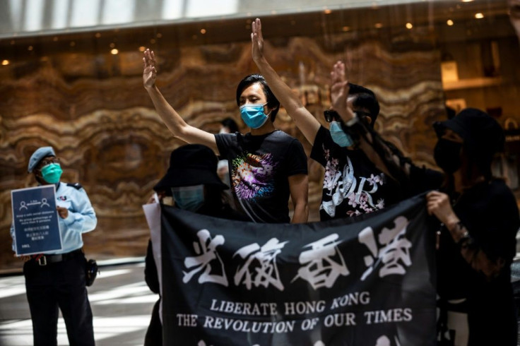 Pro-democracy protesters gather during a rally at a shopping mall in Hong Kong on June 1, 2020. China has accused Washington of double standards in how it has views action by protesters in HK and the US