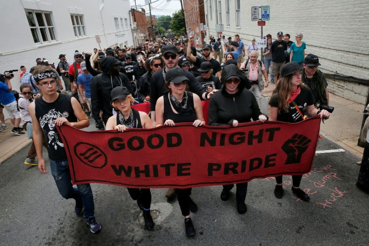 Antifa activists March in Charlottesville, Virginia in August 2018 to commemorate the killing  of Heather Heyer one year earlier by a white nationalist.