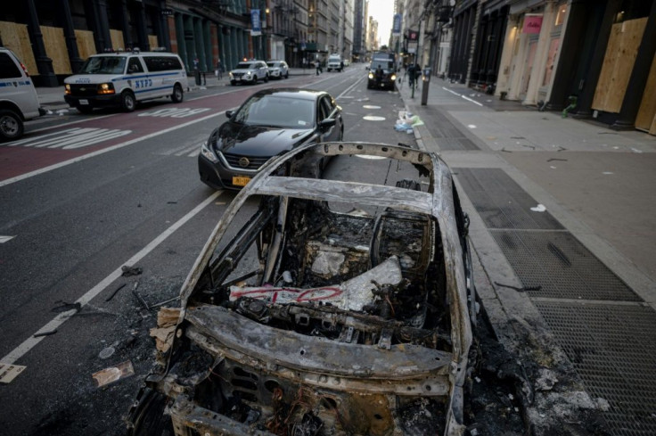 A destroyed police car is seen after a night of protest in New York