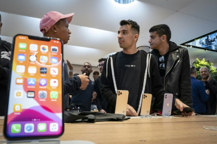 Apple's iPhone 11, seen as it went on sale last September, helped the California-based giant weather the smartphone slump better than some of its peers