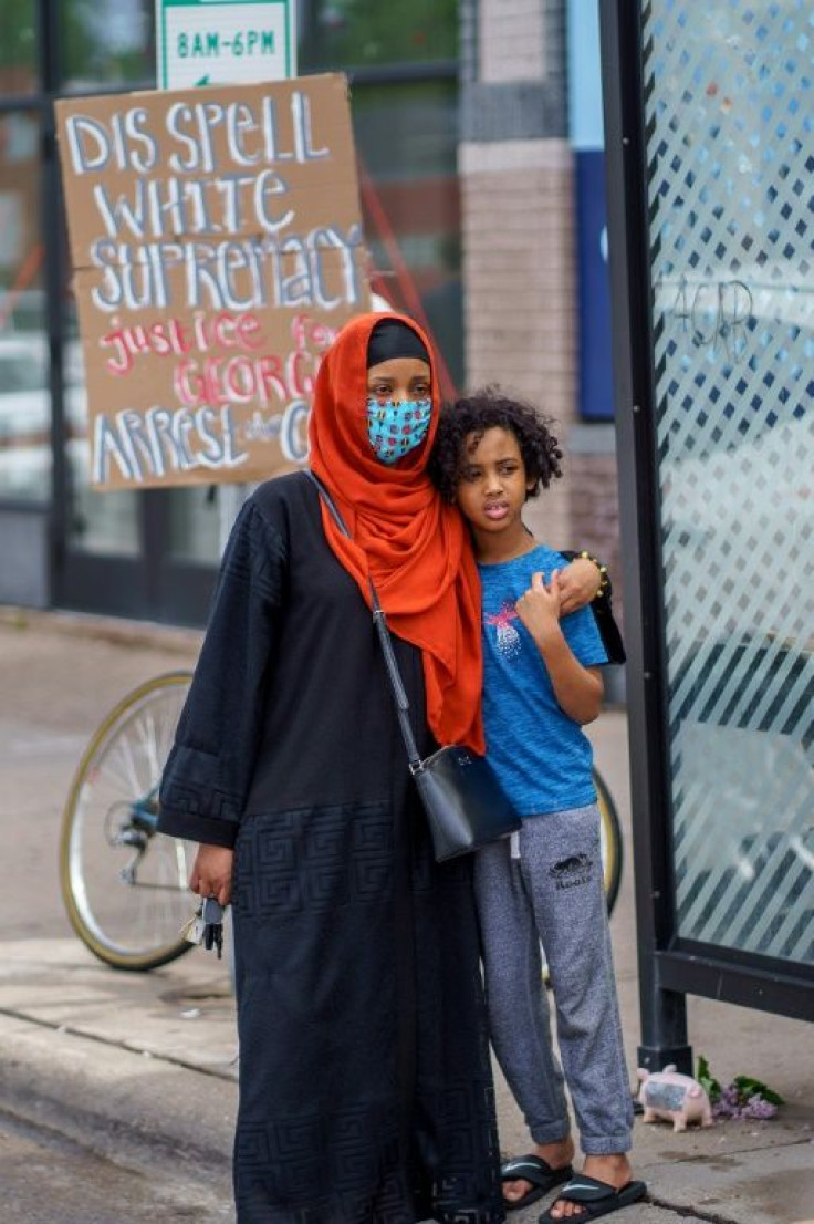 A Somali American mother and her child stand during a protest in Minneapolis against the death of George Floyd -- Minnesota has the highest percentage of refugees per inhabitant in the US, and many are from the Horn of Africa