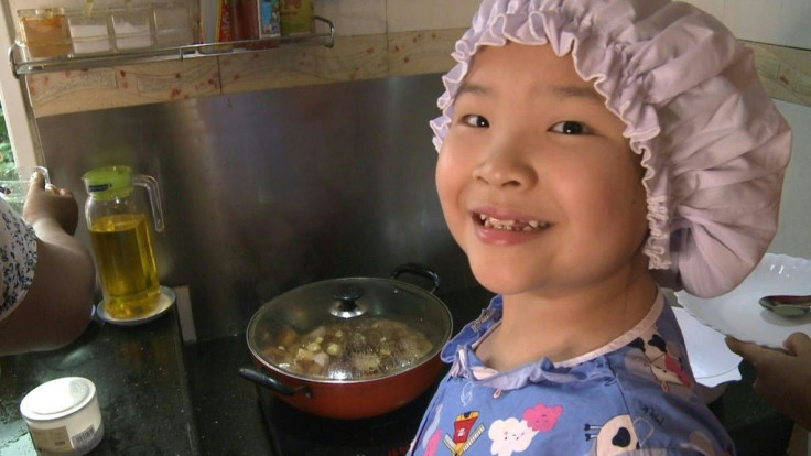 From boiled catfish soup to spicy fried frog, an eight-year-old in pyjamas and a chef's hat is delighting Myanmar with her culinary prowess in a nation still being told to stay at home due to the coronavirus pandemic.