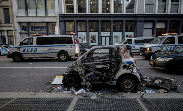 A destroyed New York police car is seen after a night of protests over the death of African-American man George Floyd