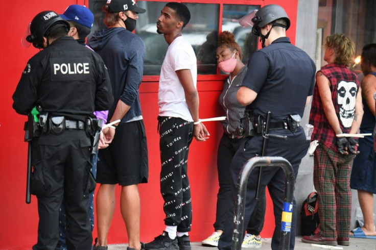 People are arrested in Hollywood, California on June 1, 2020 as police impose a curfew