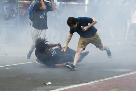 Protestors are tear-gassed as the police disperse them near the White House on June 1, 2020