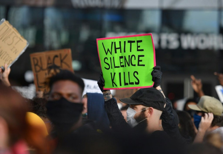 Protestors hold up placards during a Black Lives Matter demonstration in New York over the death of George Floyd