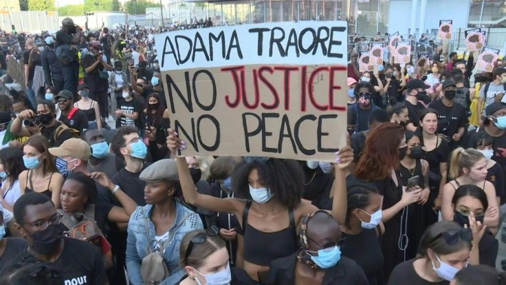 Thousands of demonstrators gather in front of the Paris High Court to show solidarity for George Floyd in the US and call for justice for Adama TraorÃ©, a 24-year-old black man who died in police custody in France in 2016.