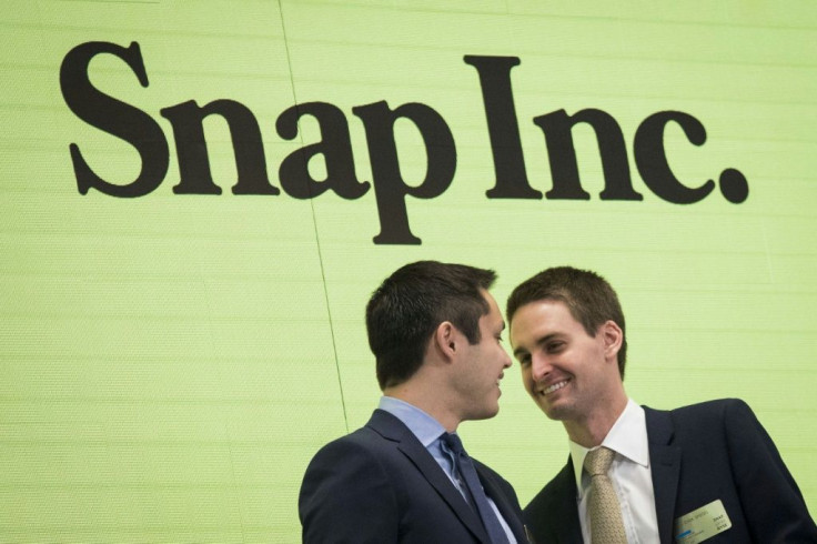 Snap CEO Evan Spiegel (R), seen in a 2017 picture, said the Snapchat platform will move to limit the reach of President Donald Trump because of comments promoting racial violence
