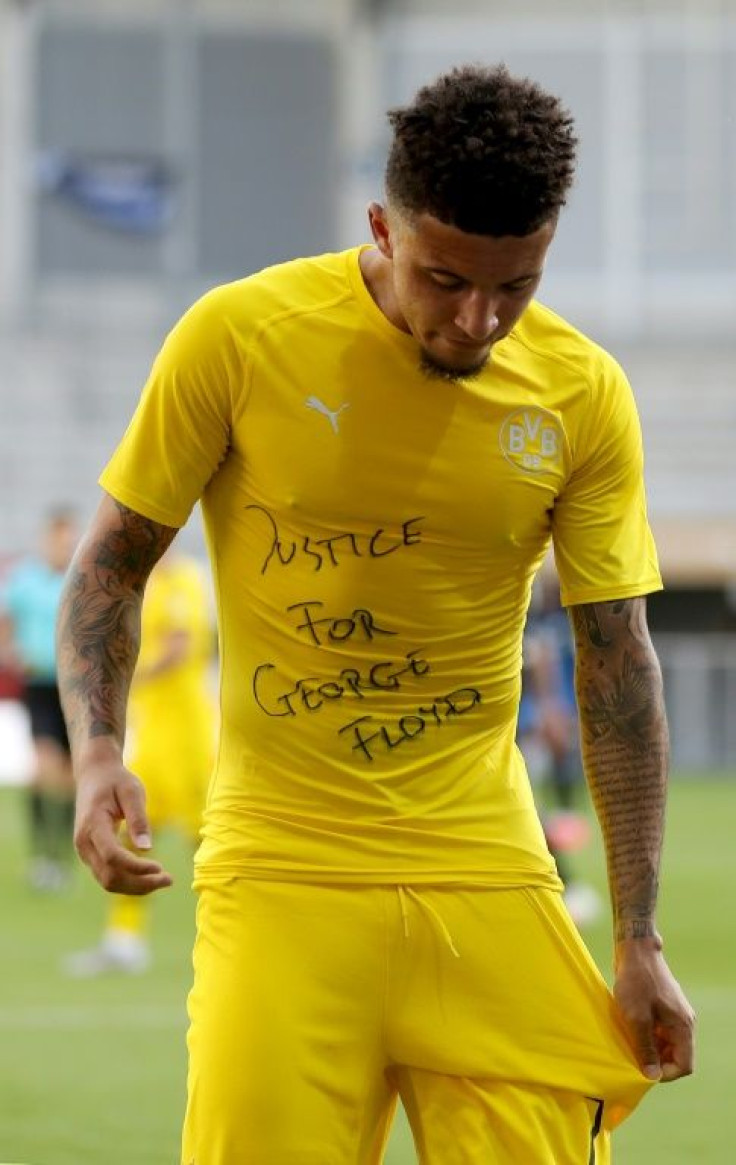 Borussia Dortmund's English midfielder Jadon Sancho escaped punishment for displaying a "Justice for George Floyd" during a Bundesliga game