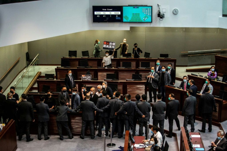 Pro-democracy lawmakers shouted slogans during the anthem debate
