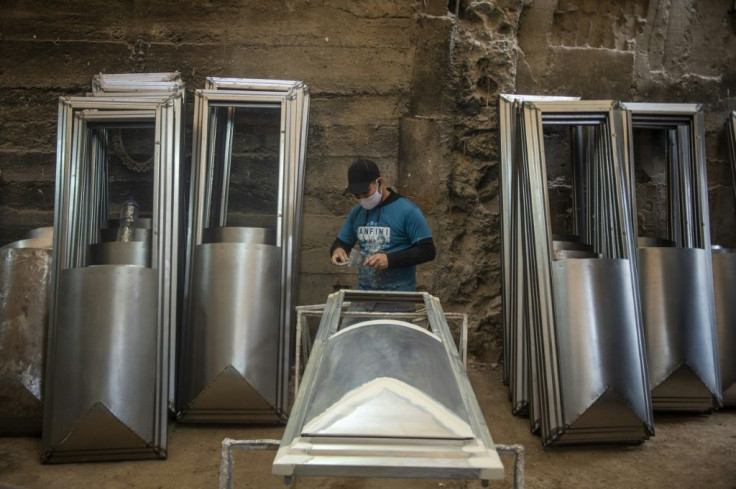 "Before the pandemic we made 100 coffins a month, now we make that many in a week!" says coffin-maker Genaro Cabrera