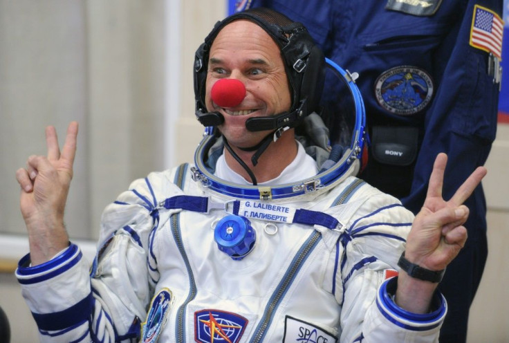 Canadian space tourist and Cirque du Soleil founder Guy Laliberte jokes during space suit testing prior to his blast off in 2009
