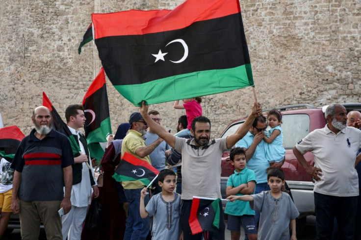 Residents of Tripoli celebrate after Libya's UN-recognised unity government announces it is back in full control of the capital and its suburbs