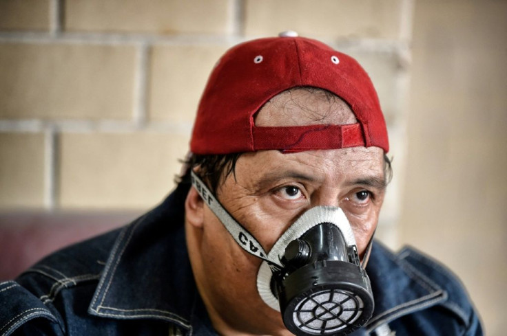 Jose Ramirez takes a rest during the cremation of a coronavirus victim in Ciudad Nezahualcoyotl