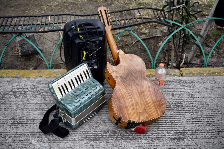 Instruments are laid aside as funeral musicians wait for work at Ciudad Nezahualcoyotl, a hotspot for coronavirus infections in Mexico