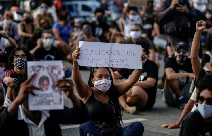 Protestors demand justice for the death of five-year-old Miguel da Silva, who fell from the ninth floor of a building while under the watch of his mother's white employer