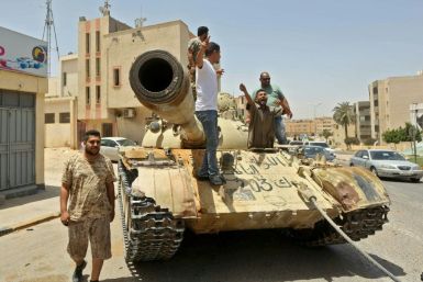 Forces of Libya's UN-recognised unity government patrol the town of Tarhuna, southeast of the Tripoli, after retaking it from fighters loyal to eastern-based strongman Khalifa Haftar