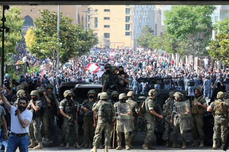 Lebanese army soldiers and security forces deployed in central Beirut to contain the anger of the protesters