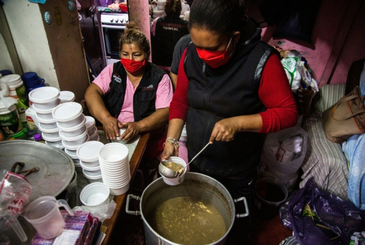 Lidia Portales, center, is helping feed sex workers deprived of their livelihoods by Peru's lockdown imposed over the coronavirus pandemic