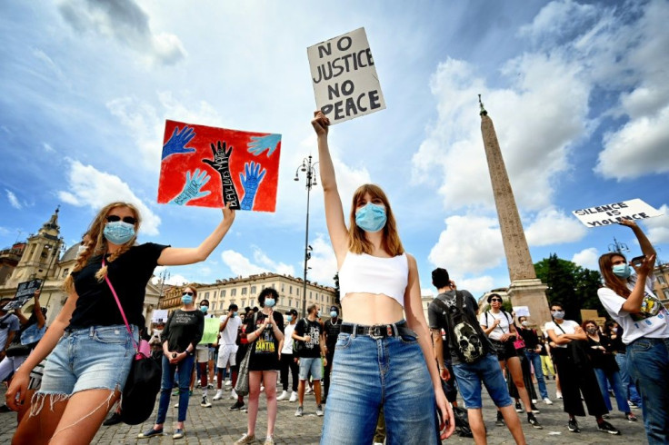 Protesters carried placards and plays drums during a rally in solidarity with the "Black Lives Matter" movement in Rome