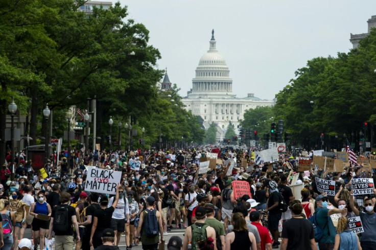 A crowd of protesters walk from the Capitol building to the White House during a peaceful protest against police brutality and racism, on June 6, 2020 in Washington, DC