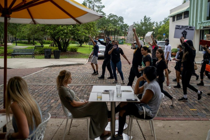 Protesters in Winter Park, Florida march on June 7, 2020 along with demonstrators in other US cities nearly two weeks after the death of George Floyd while in police custody in Minneapolis