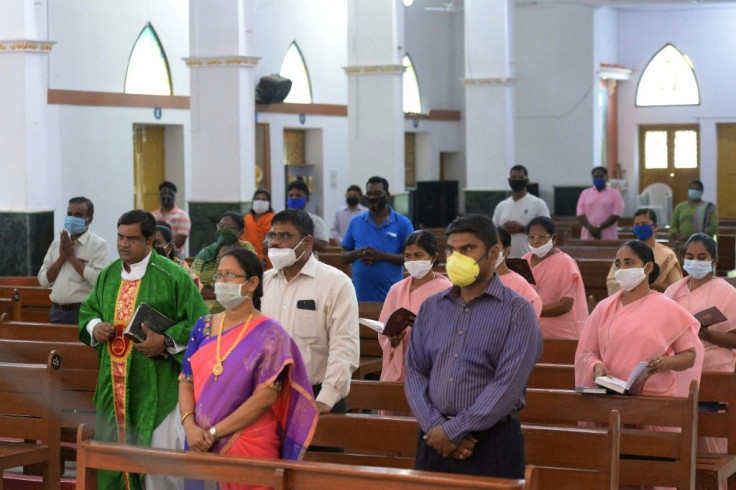 Catholic faithful keep their distance in the congregation at Saint Joseph's Church in New Delhi
