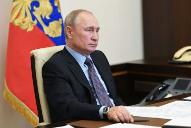 President Vladimir Putin has postponed a vote that will clear the way for changes allowing him to to stay in power beyond his current term