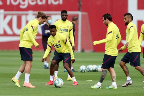 Lionel Messi and Antoine Griezmann take part in a Barcelona training session.