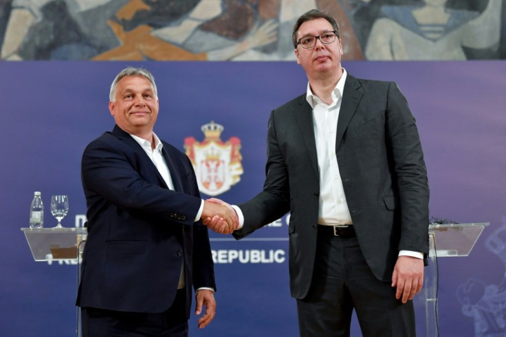 Serbian President Aleksandar Vucic (R) has deftly brought the media to heel using the same 'illiberal toolbox' as Hungary's Viktor Orban, according to the US-based Freedom House.